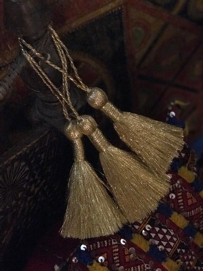 Silver and gold tassels